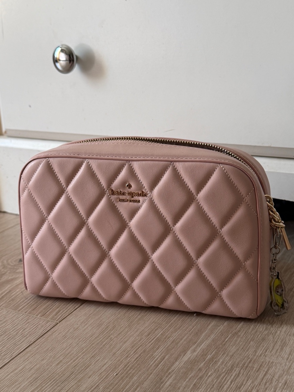 kate spade blush pink quilted cosmetic pouch with gold logo